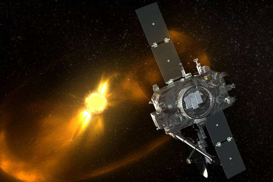A silver satellite floating in dark space 
