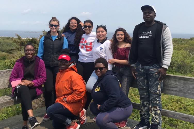 Nine students in CLOSES-GAP program stand on Appledore Island.