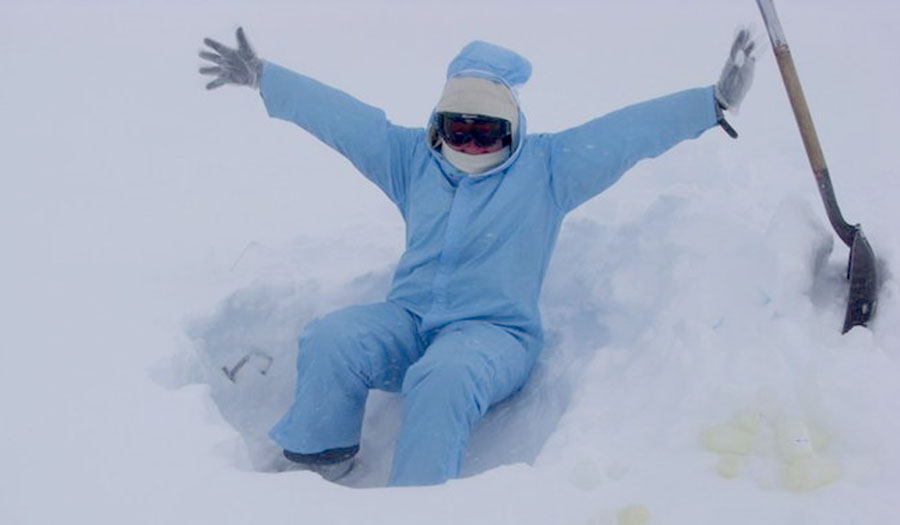 Sampling snow in a clean suit at Summit Station in Greenland in June 2010. 