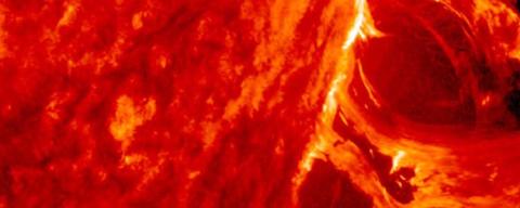 Red and orange mass coronal ejection close up.