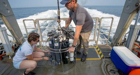 Kerry aboard UNH's R/V Gulf Challenger preparing the CTD rosette for sample collection. 