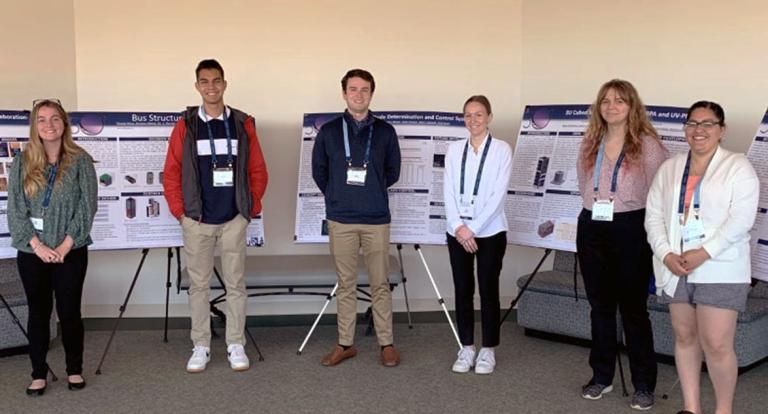 Photo of UNH and Sonoma students with their cubestat presentations.