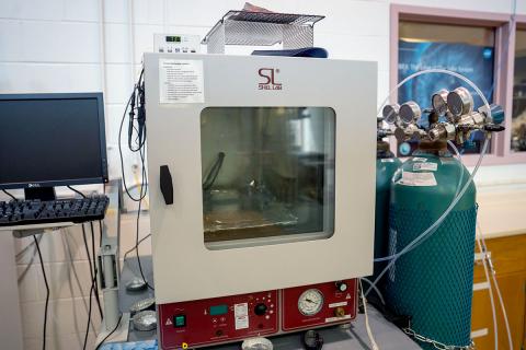 Color photo of bakeout chamber in lab. 