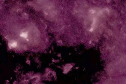 Space image with purple and black background.