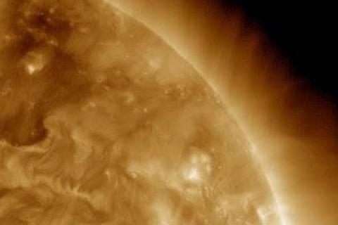 NASA image of the waves coming from a CME in space.