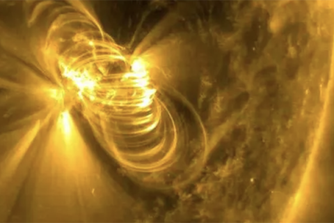 Color photo of suns rays spiraling in space.