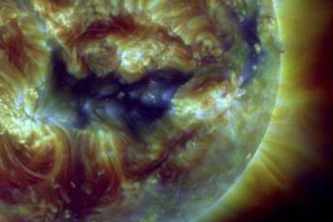 Colorful image with ring around corona. 