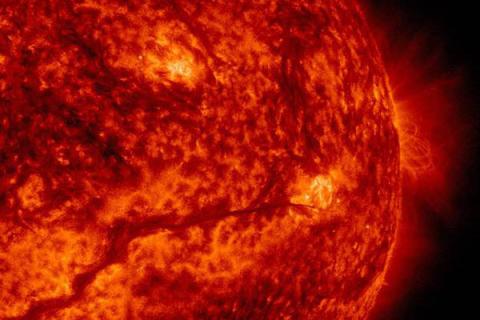 Red fiery image of solar flare. 
