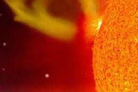 Close up orange image of solar flare. 