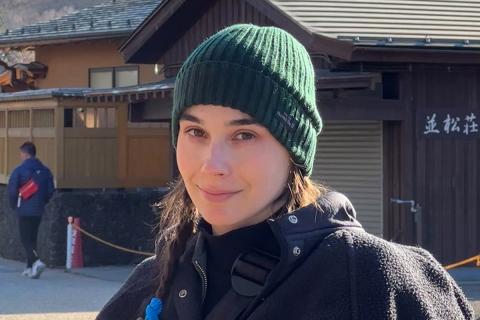 Headshot of Brianna Isola in front of a building.