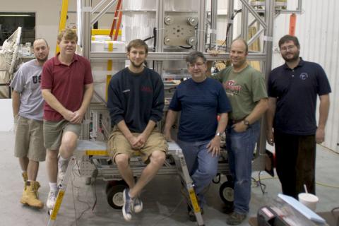 Photo of students working on the GRAPE mission. 