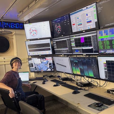 Hailey Gilman (student) and Anastasia Rose Dias (student) calibrating echosounders in the engineering tank at UNH. 