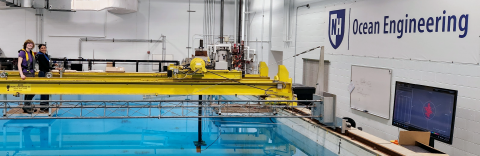 Hailey Gilman (student) and Anastasia Rose Dias (student) calibrating echosounders in the engineering tank at UNH.