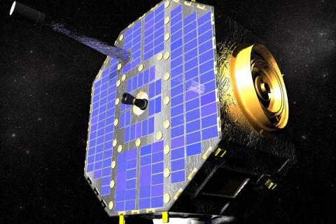 A gold satellite with blue solar panels in space