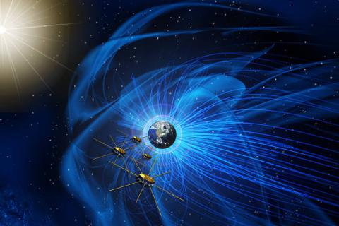 Earth with blue magnetic lines and four gold satellites with metal rods extending outward in space. 
