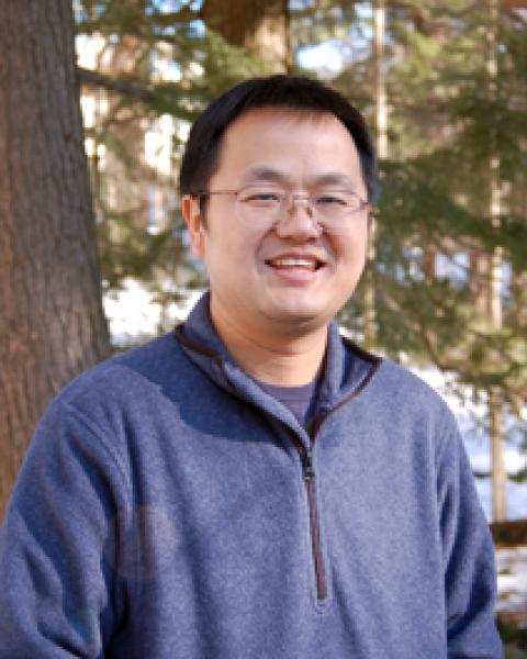 A headshot of Jingfeng Xiao, a research associate professor in the Earth Systems Research Center.