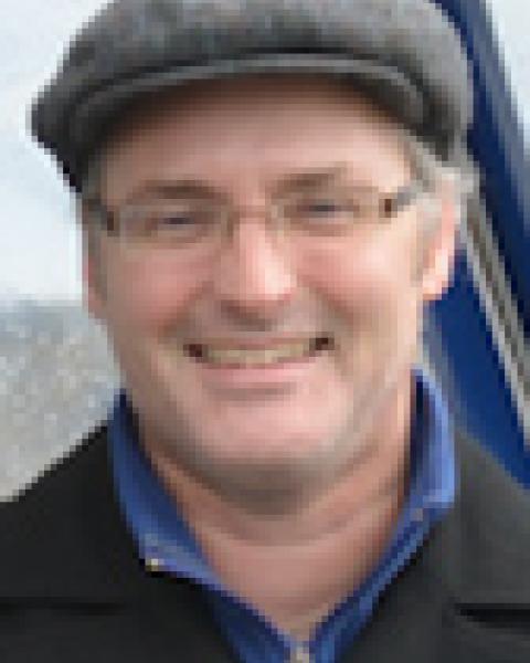 A headshot of Tim Moore