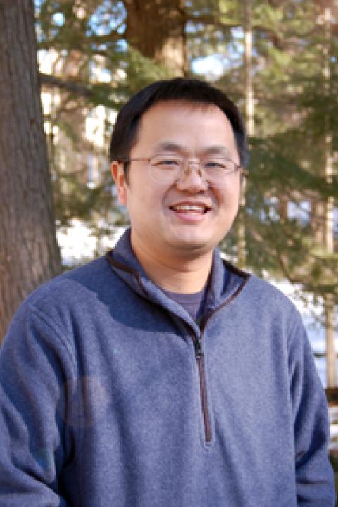 A headshot of Jingfeng Xiao, a research associate professor in the Earth Systems Research Center.